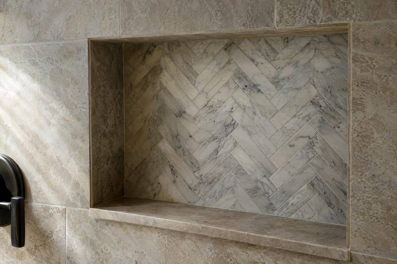 Bathroom vanity and glass shower finished in large-format gray tile